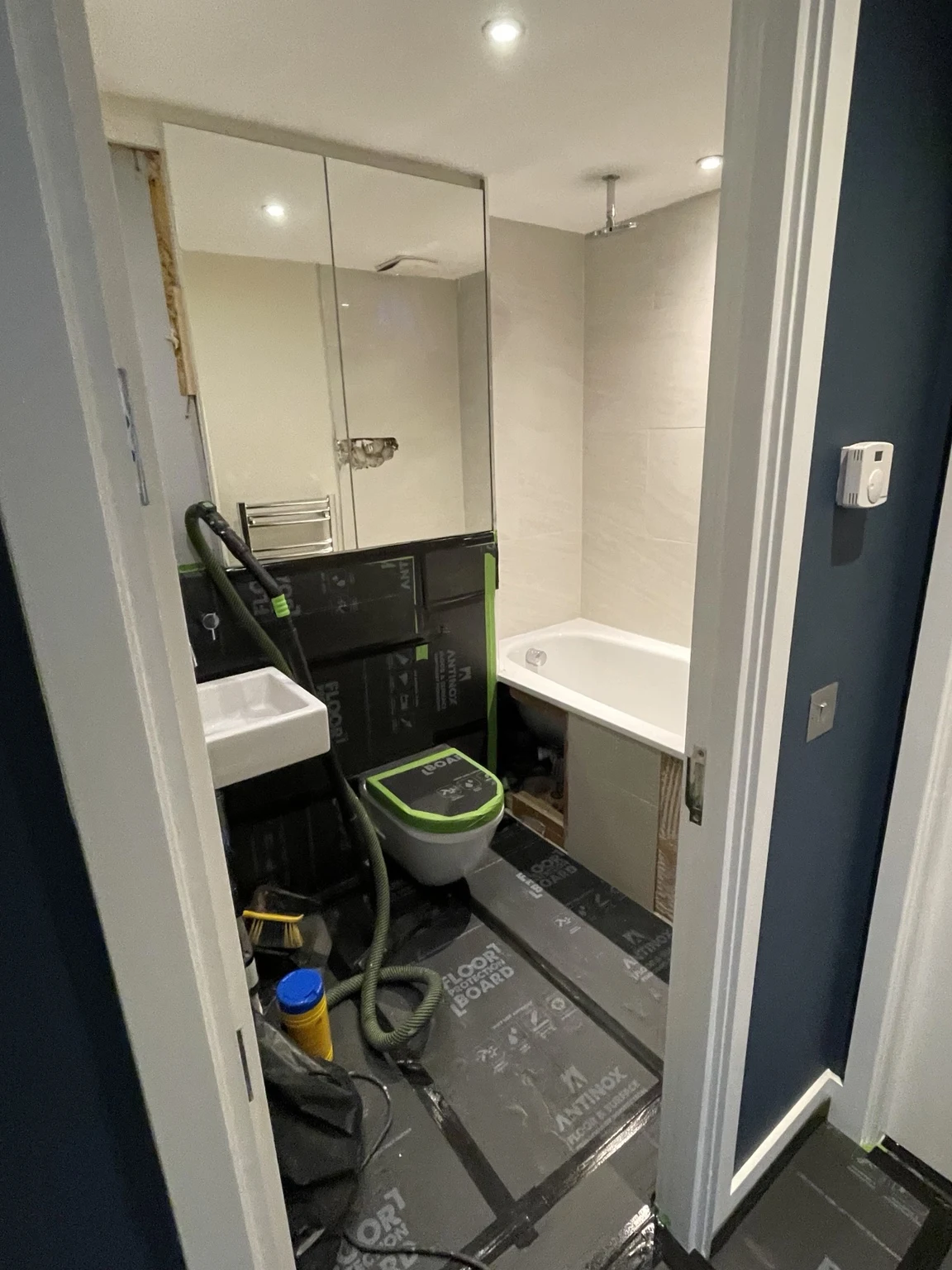 Bathroom installation with protected sanitaryware