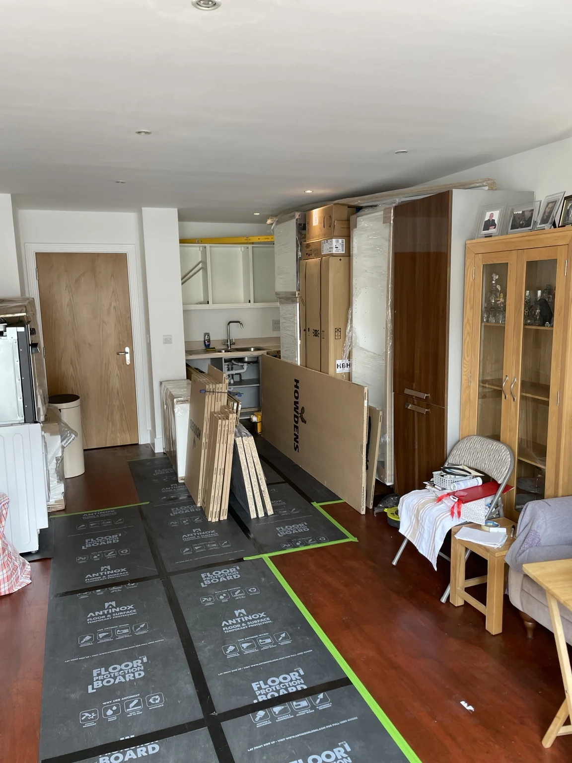 Interior kitchen renovation with protected flooring