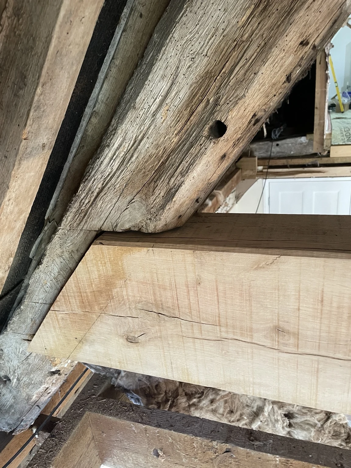 Close-up of a timber joint within a roof structure