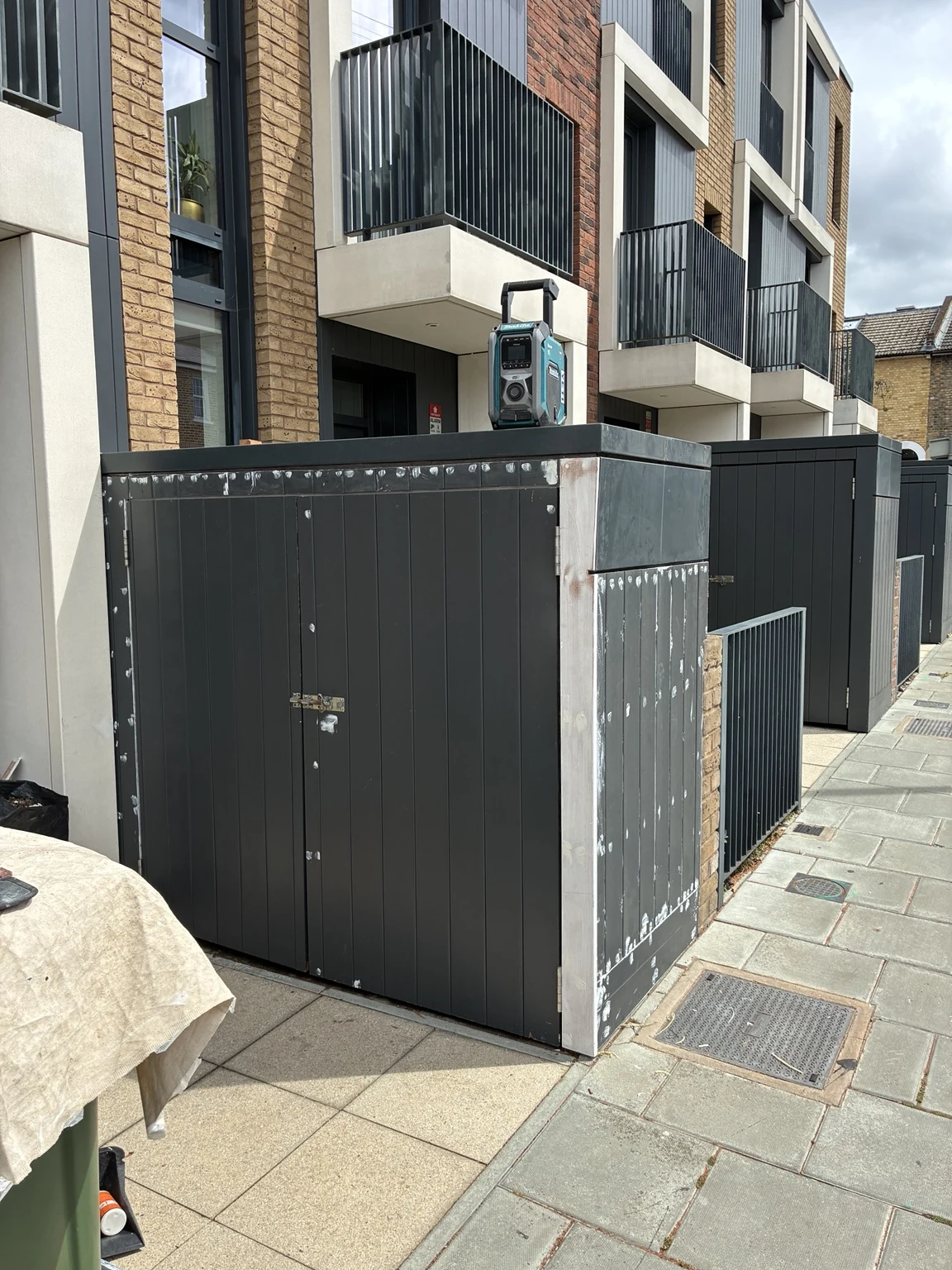 Dark exterior storage doors and surrounding enclosure