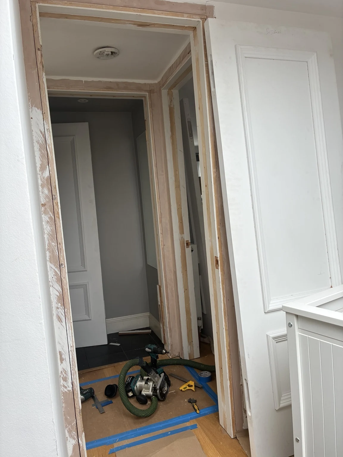 Panelled door and frame during fitting